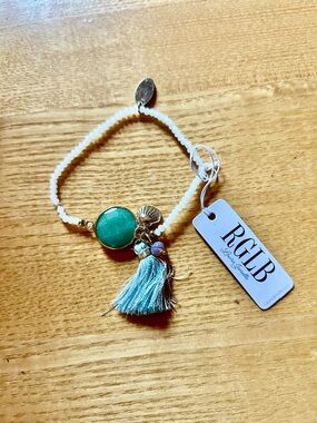 Beaded Stretch Bracelet with Aqua Stone , Tassel, Gold Seashell Charm